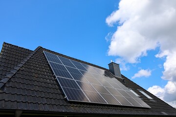 Fototapeta premium Solar panels on house roof harvesting clean energy