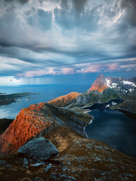 Lofoten islands stormy weather in mountains aerial view lake and rocks sunset dramatic sky landscape travel in northern Norway beautiful nature moody thunderstorm scenery epic view