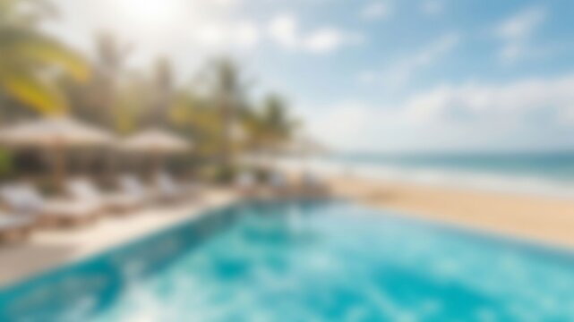 Infinity swimming pool with beach chairs and umbrellas next to a sandy ocean beach, palm trees under a sunny sky