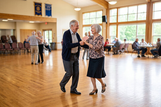 Senior Couple Dancing Together in Bright Community Dance Hall