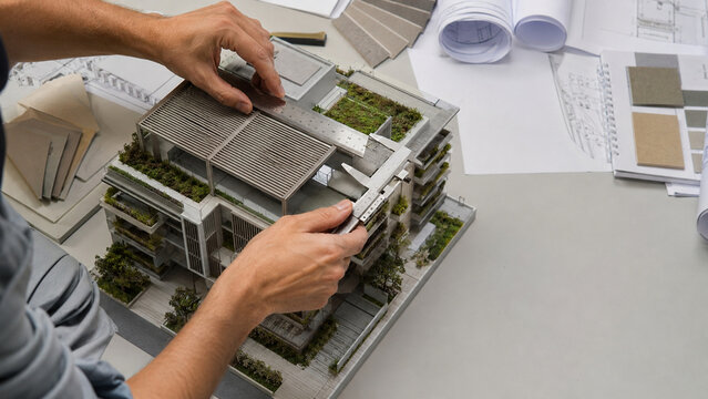 Architect reviewing passive cooling for urban buildings for modern