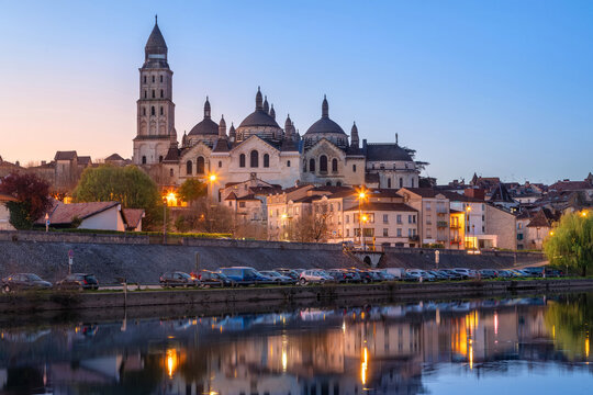 Perigueux, France - view of Cathedral at dusk reflecting in Isle river 