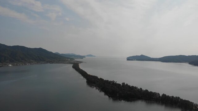 Drone aerial view moving forward over Amanohashidate sandbar, Kyoto, Japan