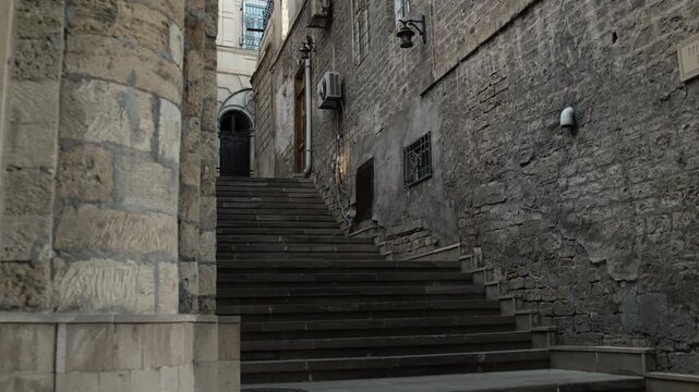 Quiet Stone Staircase Ascending Between Old Buildings