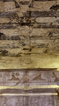 Ancient Egyptian wall paintings with detailed hieroglyphs and ritual scenes inside the Abu Simbel Temple, revealing sacred art, mythology, and preserved history. Egypt.
