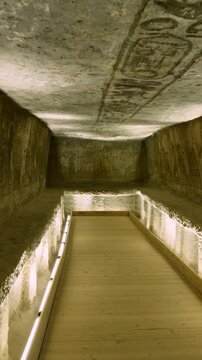 Ancient Egyptian wall with detailed hieroglyphs and ritual scenes inside the Abu Simbel Temple, revealing sacred art, mythology, and preserved history. Egypt.