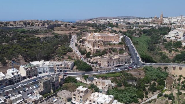 Mgarr, Gozo, Malta 29.06.2026 - Aerial view of Church of the Madonna of Lourdes in Mgarr, close to the fery terminal . High quality 4k footage
