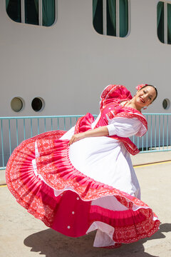 Latin Woman Dancing with Traditional Clothes