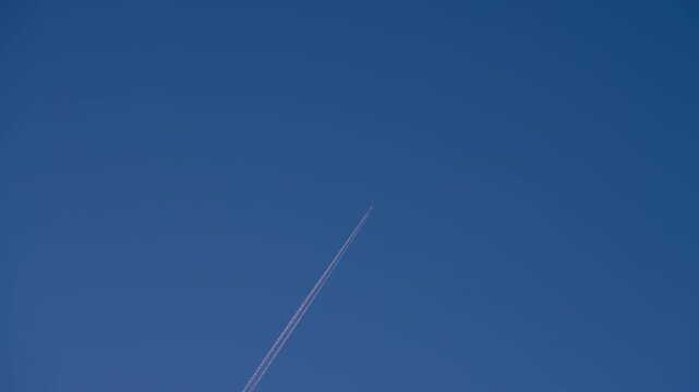 A jet soaring across the boundless sky: A symbol of freedom and human ambition reaching new heights