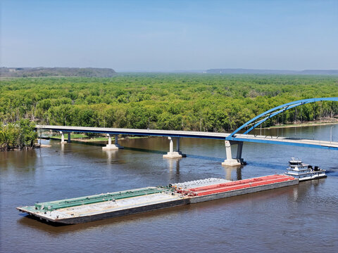 Tug boat pushing a set liquid cargo barges South down the Mississippi River