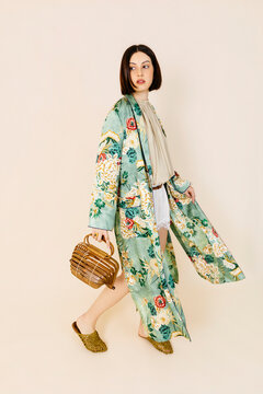 Woman wearing floral kimono and bag