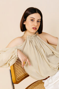 Woman wearing a cold shoulder blouse