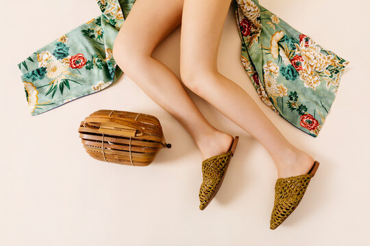 Woman wearing woven mules 