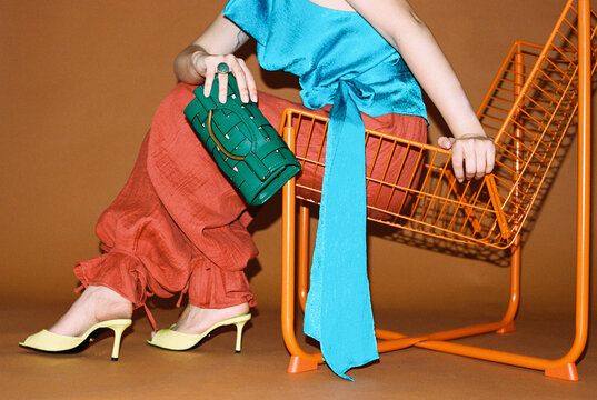 Woman holding green purse