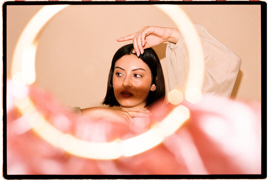 Woman with creative light frame