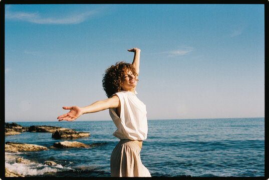 Woman with curly hair smiling