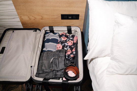 Packed Suitcase in Hotel Room