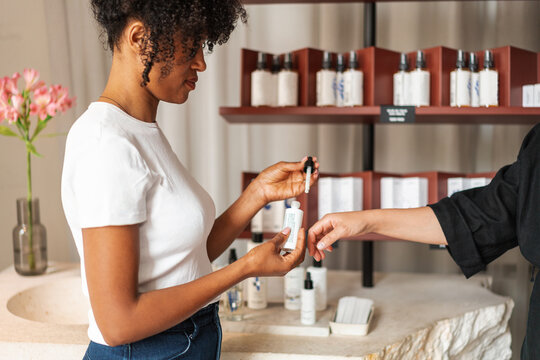 Customer Trying Skincare Serum Sample at Boutique Cosmetic 