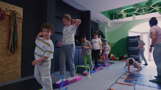 Young kids engage in a dynamic movement session, enhancing their coordination and physical development.