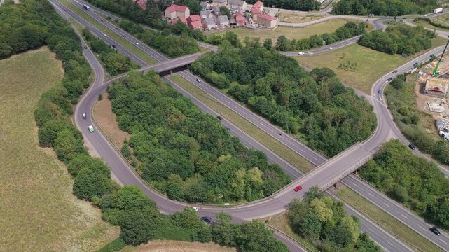 Aerial View of a Highway Interchange With Moving Traffic