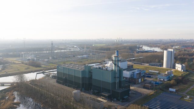 Aerial view of Vattenfall Elektriciteitscentrale Diemen power plant with industrial buildings, cooling towers, and surrounding landscape in Diemen, Noord-Holland, Netherlands.