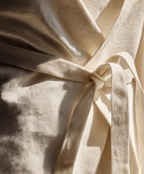 Extreme close-up of a baker's linen apron, oversized crop and tied