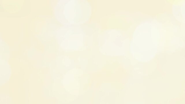 Bokeh circles shimmer in a soft cream color palette suitable for luxury branding.