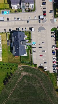 Real estate market residential district new housing development drone aerial top view. Bird's eye shot of modern neighborhood architecture showcasing fresh property investments and infrastructure