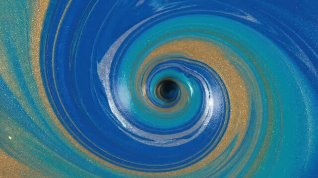A swirling vortex of metallic blue and gold liquid paint colors