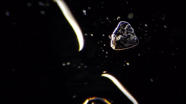 ​Salt crystals growing under microscope