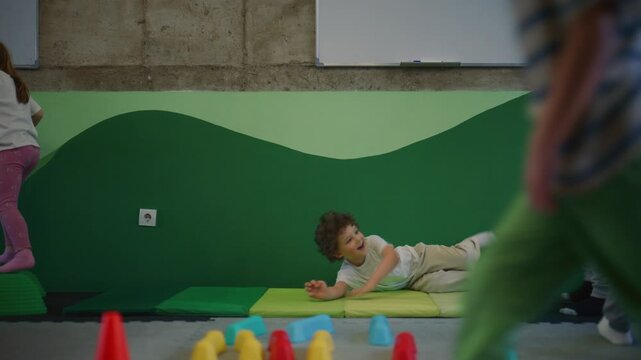 Young kids participate in physical activities, developing their strength and coordination through play.