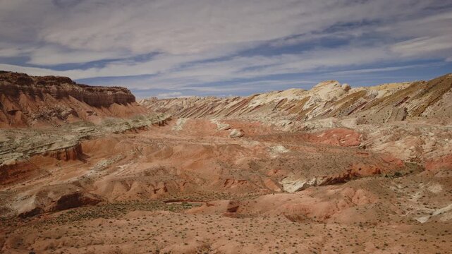 Aerial Flyover of a sandstone canyon and cliffs near the San Rafel Reef, Utah