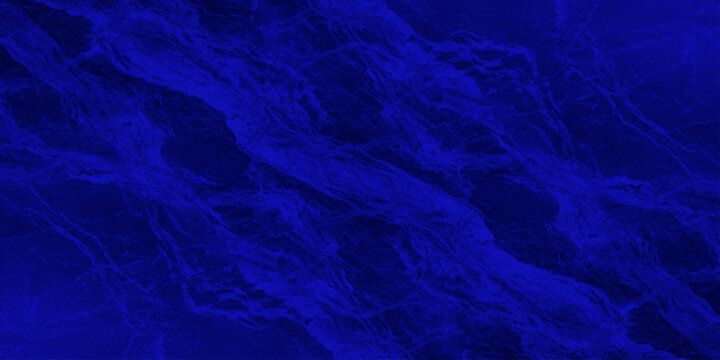 Abstract textured deep royal blue marble liquid fluid background surface with flowing veins for intense majestic backdrop design