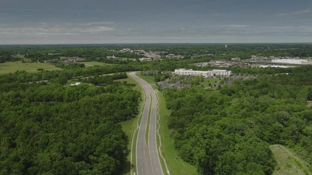 An aerial flyover of suburban highway and businesses near La Grange, Kentucky