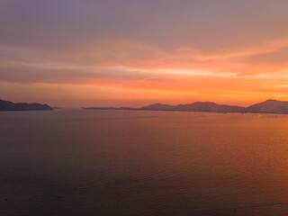 Obraz premium aerial view stunning sky in sunset above the sea. colorful cloud in bright sky of sunset above the ocean at Khao Khad Phuket. Majestic sunset or sunrise landscape Amazing light of nature background.