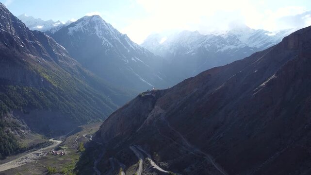 Scenic Himalayan Mountain Road Surrounded by Snow Covered Peaks