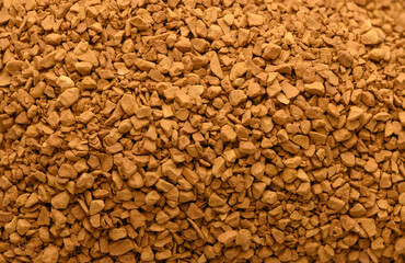 Instant coffee granules static, in unknown, with instant coffee granules, with coffee granules texture, from a top-down perspective, with brown, orange accents. © Михаил Шорохов