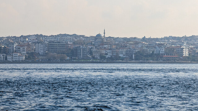 Salacak waterfront with mosque and hillside buildings in Istanbul, Turkey