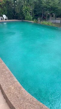 Private pool with blue water during the rain