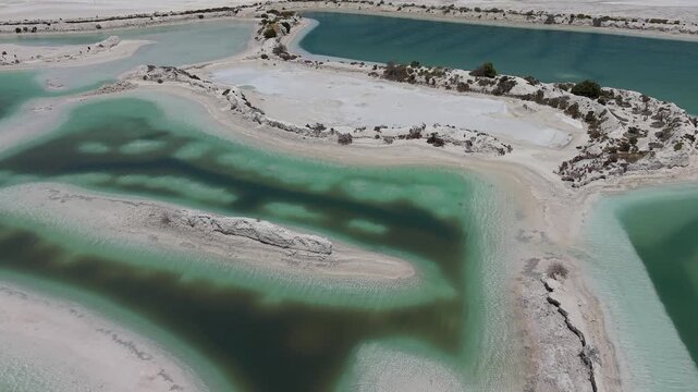 Aerial View of Turquoise Gypsum Evaporation Ponds at Jurien Gypsum Mine Near Sandy Cape Recreation Park, Western Australia