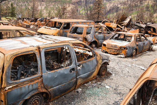 Canada, BC, Lytton, Jade Springs.  Burned remains of an old automobile scrapyard after wildfire swept through the area.