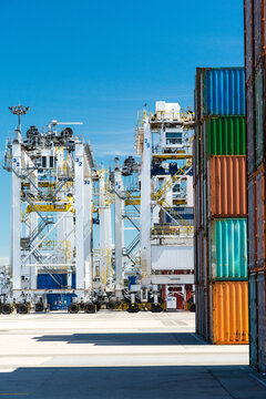 Canada, BC, Delta.  Shipping containers and container cranes at Deltaport, a deepwater port on the Georgia Strait, 35km south of Vancouver.
