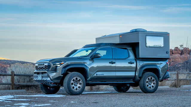 Fort Collins, CO, USA - January 21, 2026: Moonlander camper by Radica on Toyota Tacoma Trailhunter hybrid truck in Lory State Park, Colorado.