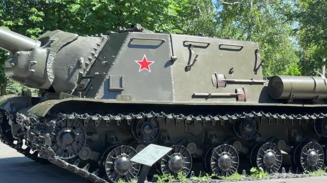 Soviet Self-Propelled Gun: A massive Soviet self-propelled gun, adorned with a prominent red star, sits on display, its imposing tracks and powerful cannon hinting at its historical significance.