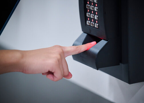 Technology Professional Scanning Fingerprint to Access Server Room