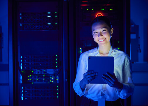 Asian Woman Managing Cloud Infrastructure in Data Center