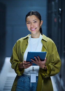 Female Technology Engineer Using Digital Tablet in Data Center