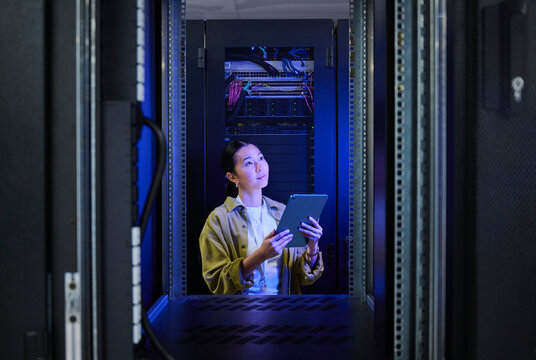 Female IT Professional in Data Center
