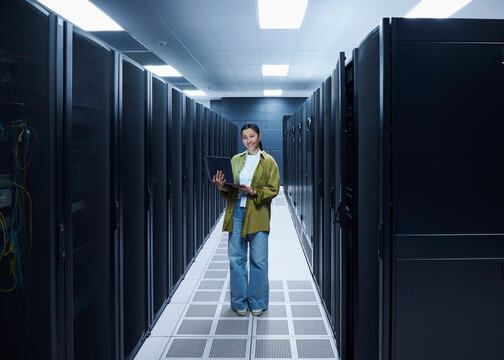 Female IT Professional in Data Center