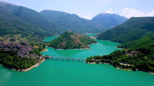 Castel di Tora Colle di Tora Lake Turano Lazio Italy Aerial Drone Panoramic Overview Showing Bridge Historic Villages Scenic Turquoise Water Mountain Valley Landscape Travel Video 4K UHD